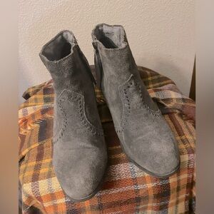 Minnetonka gray leather ankle bootie back lace up detail.